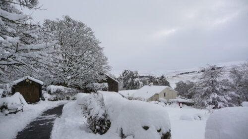 Throssel buildings with snowy valley beyond